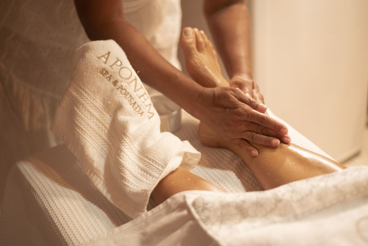 about-us-02 Close-up of a foot massage at Aponema Spa, emphasizing relaxation and wellness.